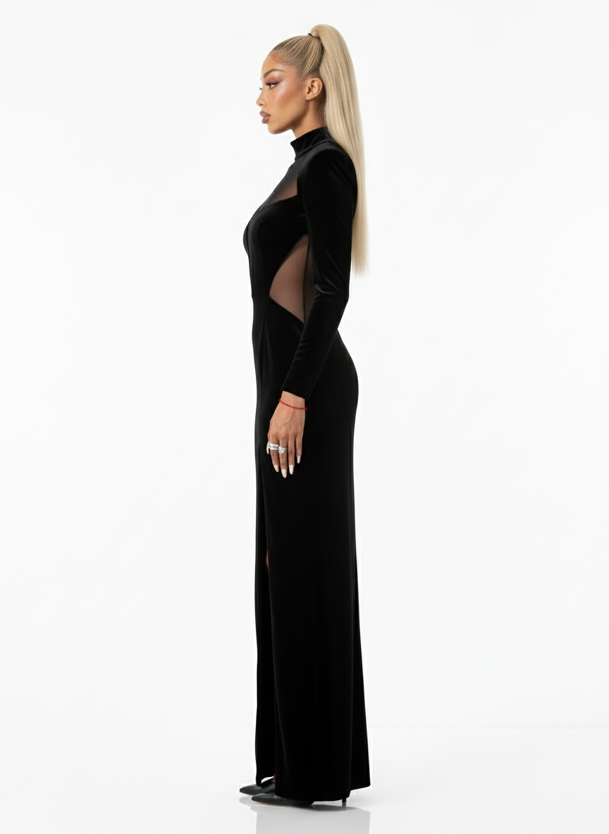 Woman wearing a black dress with cut-out details on a white background